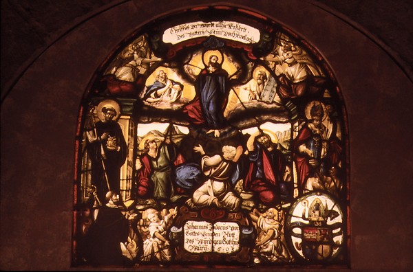 The transfigured Christ appears in radiant glory above the apostles.