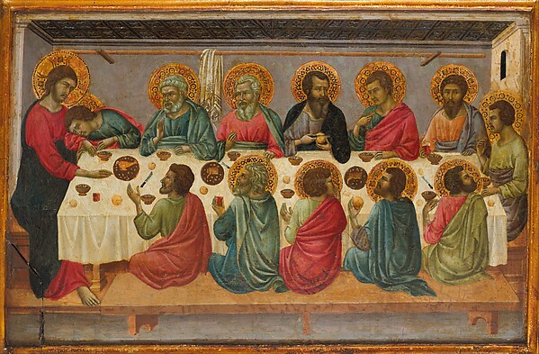 Christ and the apostles gather around the table at the Last Supper.